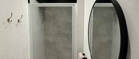 Shower, towels, soap, toilet paper