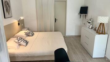 1 bedroom, desk, iron/ironing board, travel crib