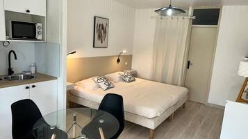 1 bedroom, desk, iron/ironing board, travel crib