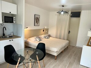1 bedroom, desk, iron/ironing board, travel crib