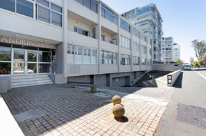 A modern building with a sign reading "ANDRINGHAM". - Sandringham 45 (Cape Town)