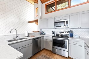 Fully equipped kitchen with stainless appliances, stone counters, and elevated breakfast bar seating. - KBM Resorts | Ridgepoint | Ski-in/Ski-out access, Common Hot Tub, Summer pool, Tennis, Parking, in Silver Lake Deer Valley! RGT-117 (Park City)
