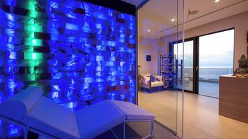 Enjoy a serene ocean view from the comfort of your room, featuring a spacious seating area and a clear view of the sea.