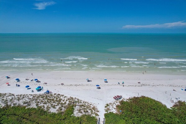 On the beach, sun loungers, beach towels