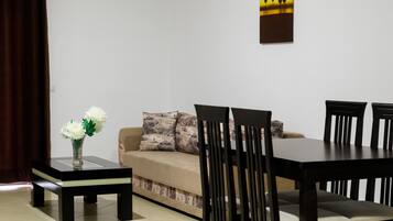 Grand Apartment | Living area | 43-inch LED TV with cable channels