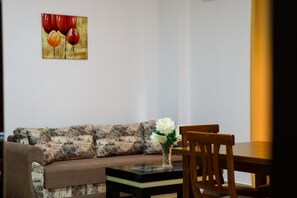 Classic Apartment | Living area | 43-inch LED TV with cable channels - Grand Blue (Sarandë)