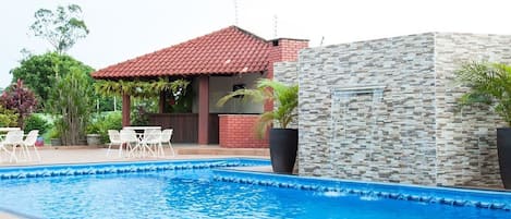 Outdoor pool, open 9:00 AM to 10:00 PM, pool umbrellas, pool loungers