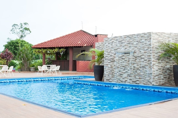 Outdoor pool, open 9:00 AM to 10:00 PM, pool umbrellas, sun loungers