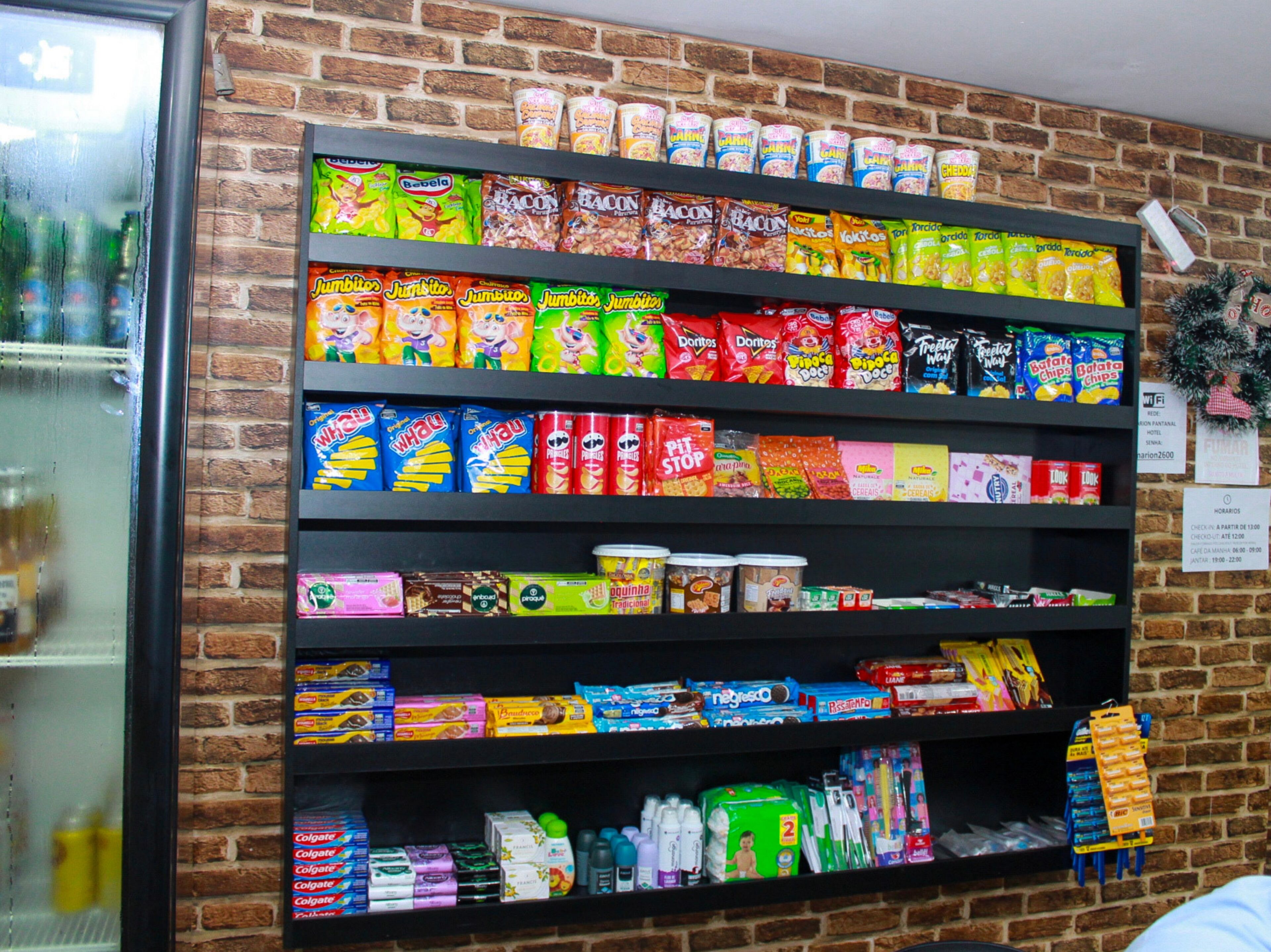 A snack shelf with various brands and types of snacks.