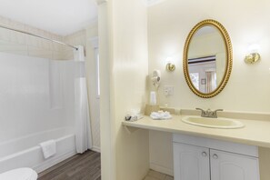 Combined shower/bathtub, hair dryer, soap, shampoo