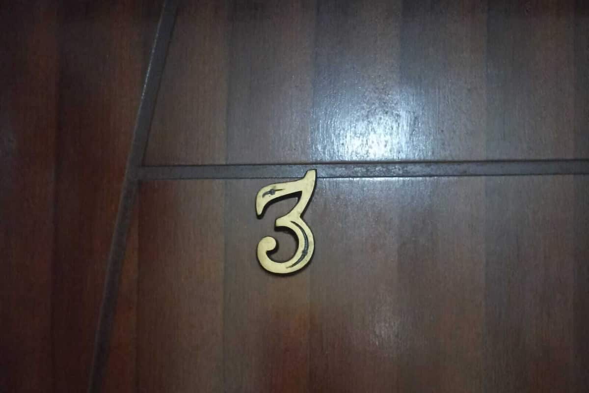 A wooden floor with a number '3' indicating room number.