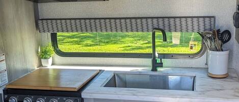 Fridge, microwave, stovetop, coffee/tea maker