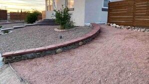 A modern house with a stone pathway leading to the front door, surrounded by a wooden fence. - ⭐️⭐️⭐️La Casita El Paso West side Buena Vista (El Paso)