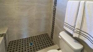 A bathroom with a shower, a toilet, a window, and a towel rack. - ⭐️Private stand-alone studio Central⭐️ (El Paso)