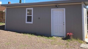 A small, single-story building with a white door and a window. - ⭐️Private stand-alone studio Central⭐️ (El Paso)