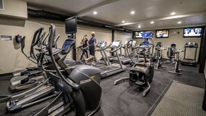 A gym with treadmills, ellipticals, and weight machines. - The Summit 66 Walk to Eagle Lodge Chair 15 (Mammoth Lakes)