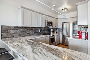 Fridge, microwave, oven, dishwasher - Mtn-View Apt w/ Deck in Historic Virginia City (Virginia City)