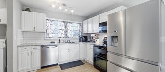 Cozy house in quiet neighborhood with hot tub, fire pit, and arcade games!