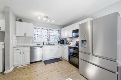 Cozy house in quiet neighborhood with hot tub, fire pit, and arcade games!