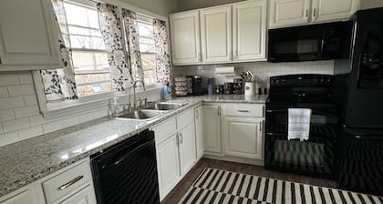 Cozy house in quiet neighborhood with hot tub, fire pit, and arcade games!