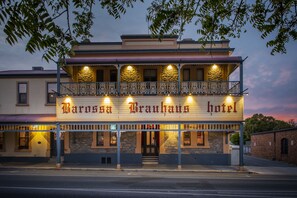 A Barossa Brauhaus hotel with a two-story facade, stone accents, and a balcony with ornate railings. - Barossa Brauhaus Hotel  (Angaston)