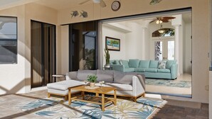 Ein Wohnzimmer mit einer Couch, einem Couchtisch und einer Topfpflanze.