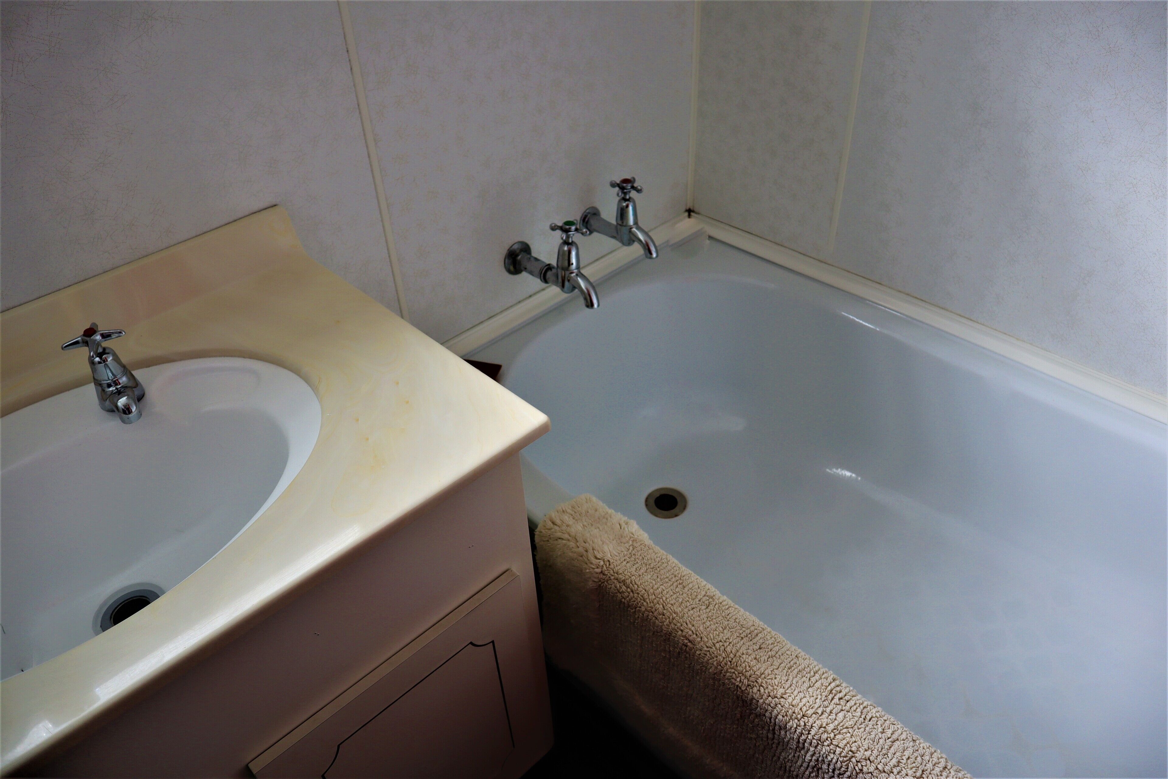 A bathroom with a sink and a bathtub.