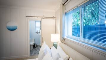 1 bedroom, desk, iron/ironing board, travel crib