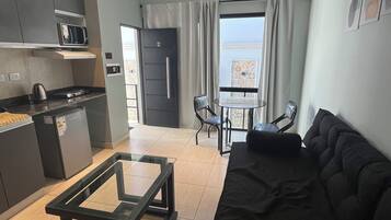 Exclusive Apartment | Living area | Flat-screen TV