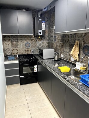 Family Apartment | Private kitchen | Mini-fridge, microwave, stovetop, electric kettle