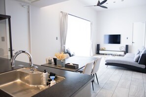 Luxury Villa | Living area | 55-inch LCD TV with digital channels, Netflix, MP3 dock - SARAH RESORT VILLA UMI (Motobu)