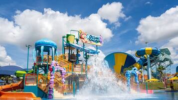 A water park with a sign reading "Ocean Kingdom" and various water slides and play structures.