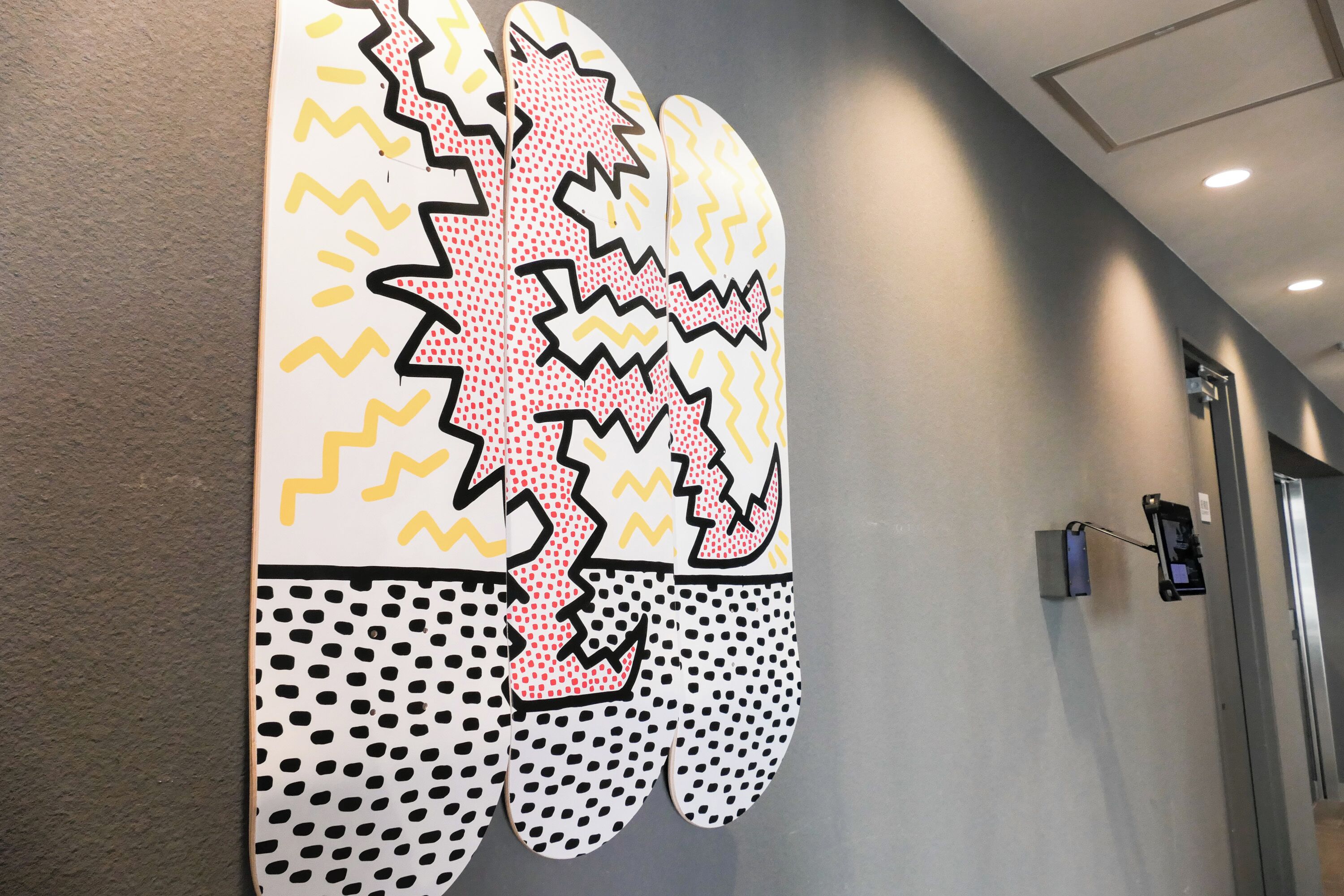 A hallway with a large, colorful mural on the wall.