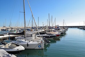 A marina with multiple boats docked along a calm waterway. - Ref 318 Sea front 2 bedroom apartment in the centre of Fuengirola next to the port (Fuengirola)