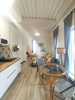 Superior Apartment | Living area | Flat-screen TV