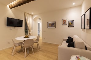 Comfort Apartment | Living area | 43-inch Smart TV with digital channels