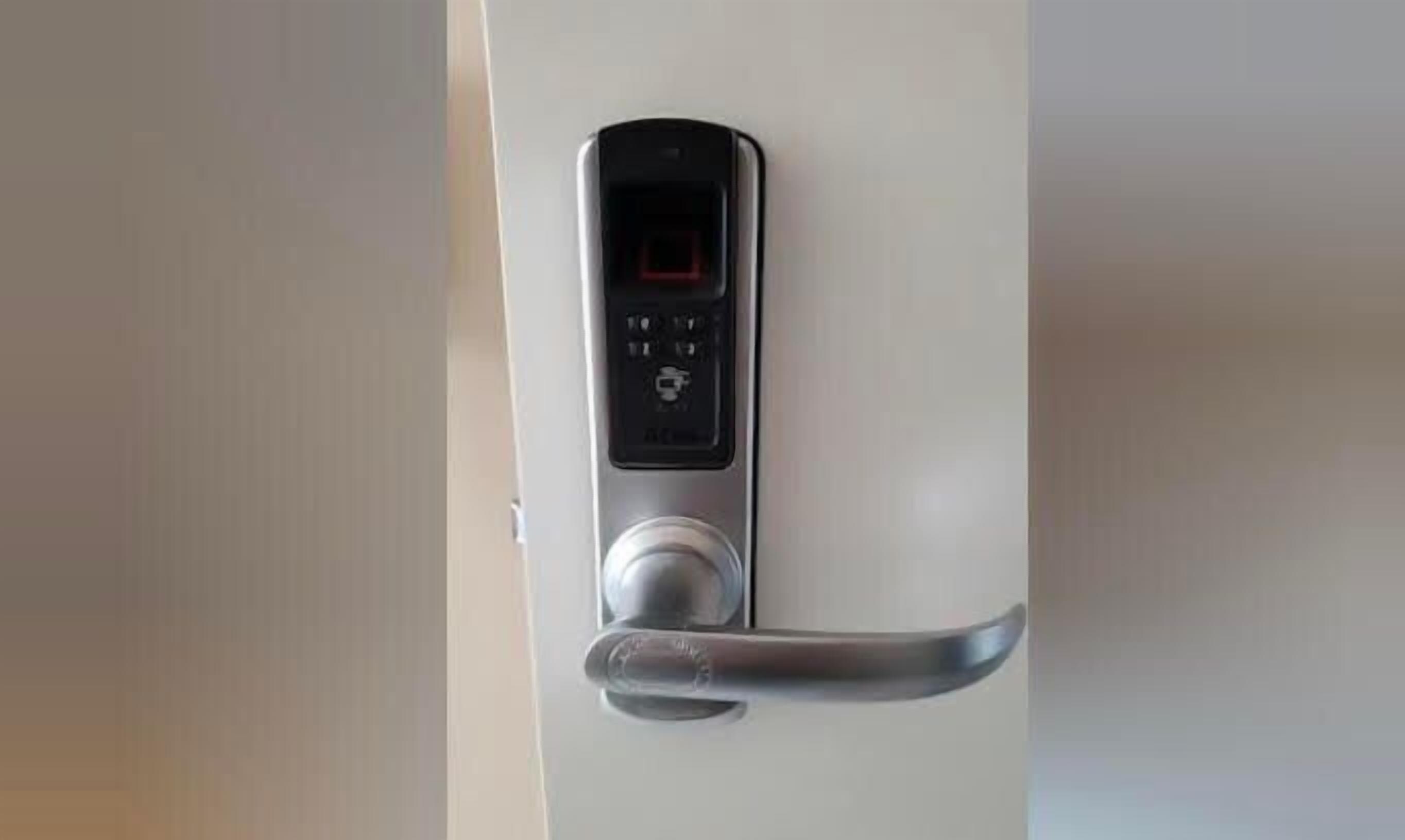 A digital door lock with a keypad and a keyhole.