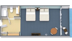 A 2-bedroom suite with a balcony, a bathroom, a small kitchen, and a seating area with a round table.