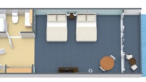 En suite med to soveværelser, balkon, badeværelse, lille køkken og opholdsområde med et rundt bord og stole.