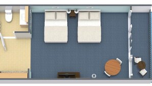 Een kamer met een bed, twee nachtkastjes, een zithoek met een ronde tafel en stoelen, een raam en uitzicht op zee.