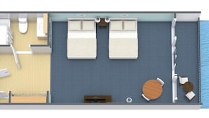 A 2-bedroom suite with a balcony, a bathroom, and a small dining area.