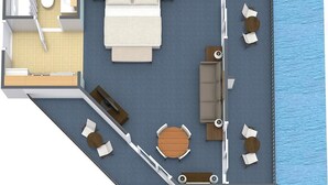 Une pièce comprenant un lit, un bureau, une chaise, une petite table et une fenêtre donnant sur une étendue d’eau.