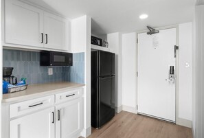 Fridge, microwave, coffee/tea maker, dining tables