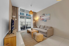 50-inch Smart TV with cable channels, Netflix, streaming services - Waves - Charming Apt With Balcony, Minutes From The Beach (Dubai)