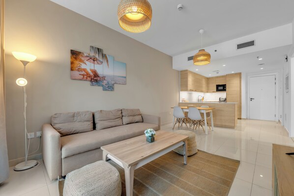 50-inch Smart TV with cable channels, Netflix, streaming services - Waves - Charming Apt With Balcony, Minutes From The Beach (Dubai)