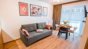 Apartment (Cicha 12/24 A 2) | Living area | Flat-screen TV - Apartamenty Sun & Snow Cicha (Krynica-Zdroj)