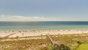 A beach with a wooden boardwalk leading to the shore, sandy beach, and ocean. - Perdido Key Condo w/ Ocean-view Balcony! (Pensacola)