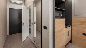 A modern bathroom with a shower, toilet, and sink. - Jam Apartments (Lviv)
