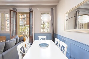 Enjoy meals for two in this cozy dining area with a mirror, window, and comfortable seating.