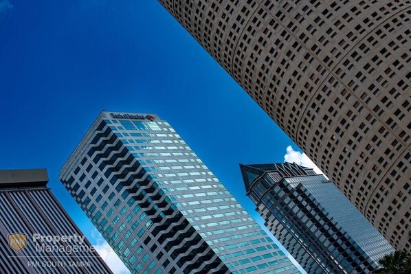 Standing tall with a unique zigzag facade, this building showcases a contemporary architectural style.